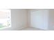 Light and airy bedroom with a window and spacious closet with bi-fold doors at 13098 Convent Garden Rd, Brooksville, FL 34614