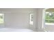Bright bedroom with fresh paint, lots of natural light, and neutral carpeting at 13098 Convent Garden Rd, Brooksville, FL 34614