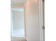 Hallway with an open doorway leading to a carpeted room at 13098 Convent Garden Rd, Brooksville, FL 34614