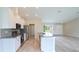 Spacious kitchen with granite countertops, stainless steel appliances, and a kitchen island at 13098 Convent Garden Rd, Brooksville, FL 34614