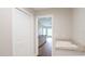 Hallway leading to laundry room, featuring a utility sink and ample storage space at 13098 Convent Garden Rd, Brooksville, FL 34614