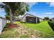 Expansive backyard with mature trees, offering privacy and a serene atmosphere for outdoor enjoyment at 13523 Meadow Golf Ave, Hudson, FL 34669