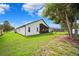 Well-maintained backyard with mature trees, providing shade and privacy to this lovely property at 13523 Meadow Golf Ave, Hudson, FL 34669