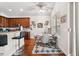 Sunny dining area with hardwood floors, a breakfast bar, and a view of the kitchen for easy entertaining at 13523 Meadow Golf Ave, Hudson, FL 34669