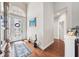Welcoming foyer boasts gleaming hardwood floors, high ceilings, and an arched window above the entry door at 13523 Meadow Golf Ave, Hudson, FL 34669