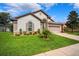 Well-maintained one-story home with a two-car garage, beautiful lawn, and attractive landscaping at 13523 Meadow Golf Ave, Hudson, FL 34669