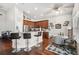 Bright kitchen with stainless steel appliances, breakfast bar, and adjacent dining area at 13523 Meadow Golf Ave, Hudson, FL 34669