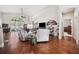 Large living area with hardwood floors, a vaulted ceiling, and comfortable seating at 13523 Meadow Golf Ave, Hudson, FL 34669