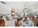 Spacious living room boasts hardwood floors, vaulted ceilings, and comfortable seating arrangement at 13523 Meadow Golf Ave, Hudson, FL 34669