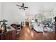 Spacious living room with gleaming hardwood floors, high ceilings, and plenty of natural light at 13523 Meadow Golf Ave, Hudson, FL 34669