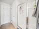 Bathroom featuring a glass shower enclosure and neutral tile flooring at 13722 Lakemont Dr, Hudson, FL 34669