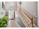 Bright and airy foyer with a staircase, tile flooring, and a front door with sidelights at 13722 Lakemont Dr, Hudson, FL 34669