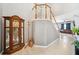 Inviting foyer with a staircase, tile flooring, and an antique grandfather clock at 13722 Lakemont Dr, Hudson, FL 34669