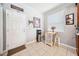 Close-up of a well-lit kitchen area with a small dining table near a door and window at 13722 Lakemont Dr, Hudson, FL 34669