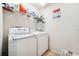 Functional laundry room with a modern washer and dryer for convenient chores at 13722 Lakemont Dr, Hudson, FL 34669