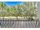 Balcony view of a tree-lined street at 1411 Tessano Pl, Palm Harbor, FL 34683