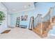 Spacious foyer with tile floors, a wooden staircase, and tasteful decor that enhances the welcoming ambiance at 1411 Tessano Pl, Palm Harbor, FL 34683