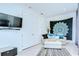 Bright living room with hardwood floors and a comfortable couch, perfect for relaxation and entertainment at 1411 Tessano Pl, Palm Harbor, FL 34683
