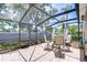 Covered patio with tiled flooring, perfect for outdoor dining and relaxation at 1411 Tessano Pl, Palm Harbor, FL 34683
