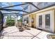Covered patio with tiled flooring, ideal for outdoor gatherings at 1411 Tessano Pl, Palm Harbor, FL 34683