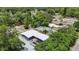 Aerial view of newly renovated home, surrounded by mature trees in quiet neighborhood at 1416 55Th N Ave, St Petersburg, FL 33703