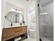 Modern bathroom featuring a double sink vanity, sleek fixtures, and a glass-enclosed shower at 1416 55Th N Ave, St Petersburg, FL 33703