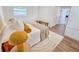 Comfortable bedroom with a bright window, a warm throw blanket, and wood floors at 1416 55Th N Ave, St Petersburg, FL 33703