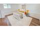 Comfortable bedroom with a bright window, a warm throw blanket, and wood floors at 1416 55Th N Ave, St Petersburg, FL 33703