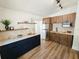 Well-lit kitchen featuring stainless steel appliances, open shelving, and modern cabinetry at 1416 55Th N Ave, St Petersburg, FL 33703