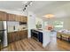Modern kitchen with stainless steel appliances, wooden cabinets, and an island at 1416 55Th N Ave, St Petersburg, FL 33703