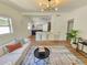 Open-concept living room and kitchen with a modern design, hardwood floors, and plenty of natural light at 1416 55Th N Ave, St Petersburg, FL 33703