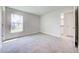 Bedroom with neutral carpet and a window with a view to the neighborhood at 16433 66Th E Ln, Parrish, FL 34219