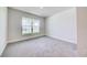 This bedroom features plush carpeting and a large window offering plenty of natural light at 16433 66Th E Ln, Parrish, FL 34219