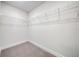 Walk-in closet featuring built-in shelving provides ample storage space at 16433 66Th E Ln, Parrish, FL 34219