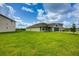 Sprawling front lawn showcases the home's curb appeal and landscaping at 16433 66Th E Ln, Parrish, FL 34219
