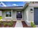 Attractive front door entrance with manicured landscaping and a welcoming walkway at 16433 66Th E Ln, Parrish, FL 34219