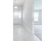 Bright and spacious hallway with white trim, fresh paint, and stylish front door at 16433 66Th E Ln, Parrish, FL 34219