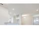 Bright living space featuring a view of the kitchen and front door, bathed in natural light at 16433 66Th E Ln, Parrish, FL 34219