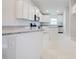 Modern kitchen with sleek appliances, granite countertops, and island with bar seating at 16433 66Th E Ln, Parrish, FL 34219