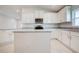 Bright kitchen featuring stainless steel appliances, granite countertops, and ample cabinet space at 16433 66Th E Ln, Parrish, FL 34219