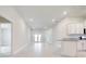Spacious, bright, open-concept living area with a view of the kitchen and the outdoors at 16433 66Th E Ln, Parrish, FL 34219