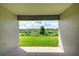 Covered patio showcasing green space and community landscape at 16433 66Th E Ln, Parrish, FL 34219