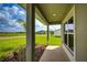 Covered porch with a view of a spacious front yard and neighboring homes at 16433 66Th E Ln, Parrish, FL 34219