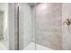Shower boasts attractive tile surround and a frameless glass enclosure at 16433 66Th E Ln, Parrish, FL 34219