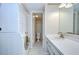 Bathroom featuring a single sink vanity and laundry machines at 1655 S Highland Ave # B118, Clearwater, FL 33756
