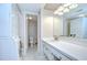 Modern bathroom featuring a single sink vanity and laundry machines at 1655 S Highland Ave # B118, Clearwater, FL 33756