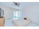 Bright bedroom with tile flooring and sliding glass doors to the backyard at 1655 S Highland Ave # B118, Clearwater, FL 33756