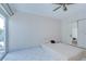Bedroom with sliding glass doors to the backyard and a ceiling fan at 1655 S Highland Ave # B118, Clearwater, FL 33756