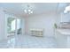 Dining space featuring tile floors, neutral walls, slider, and access to kitchen at 1655 S Highland Ave # B118, Clearwater, FL 33756