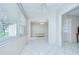 Dining area showcasing tiled floors, neutral paint, and connecting rooms at 1655 S Highland Ave # B118, Clearwater, FL 33756